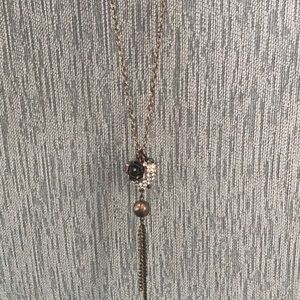 Necklace with heart, key, and ball